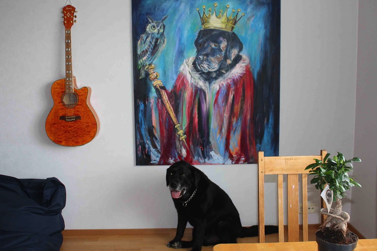 The model posing under his picture 2018